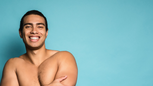 A young man with a big small covering his naked chest
